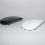 two black and white cordless mouse close-up photography