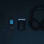 black and blue iphone case on black surface