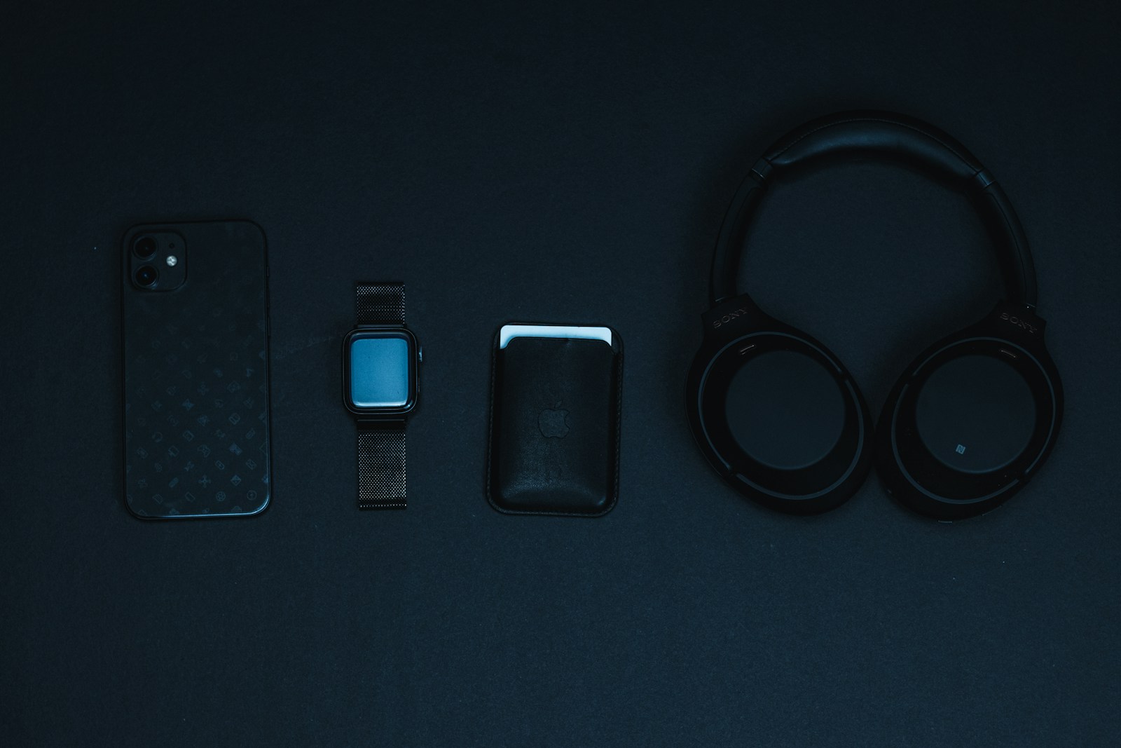 black and blue iphone case on black surface